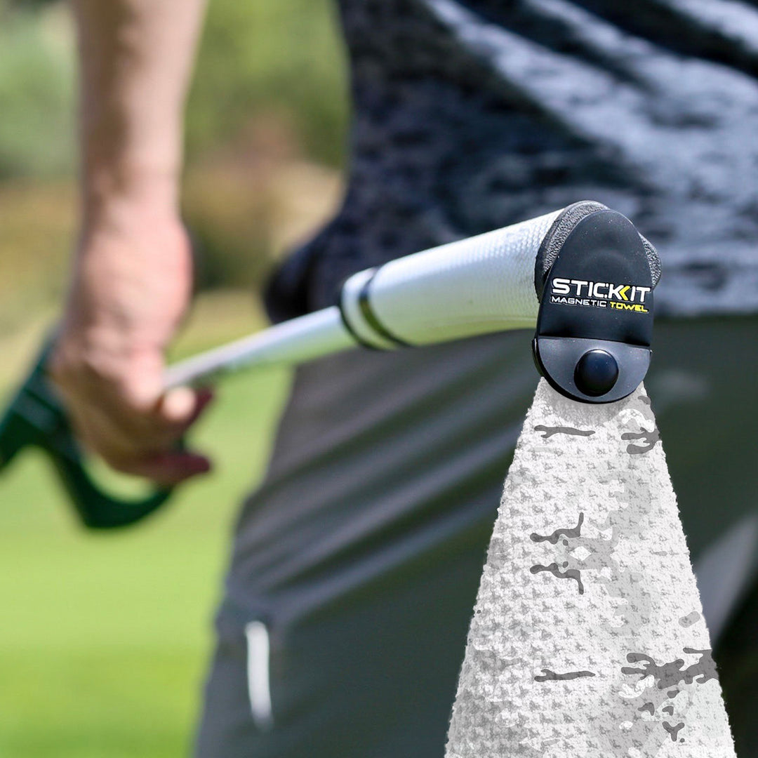 White camouflage magnetic towel attached to a golf club, perfect for sports enthusiasts and outdoor activities.