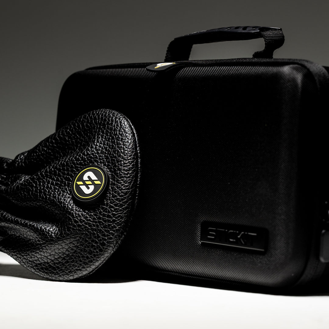 Black leather pouch and sleek black hard case bag with logo, perfect for secure storage and travel.