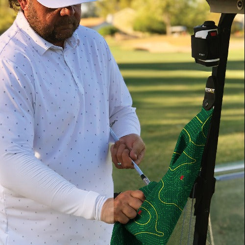 Men's white long-sleeve golf shirt with light blue dots, designed for comfort and style on the course.