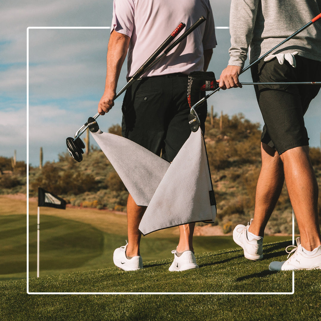 Men's lightweight gray golf towel with black accents, perfect for on-course use, featuring convenient clip attachment.