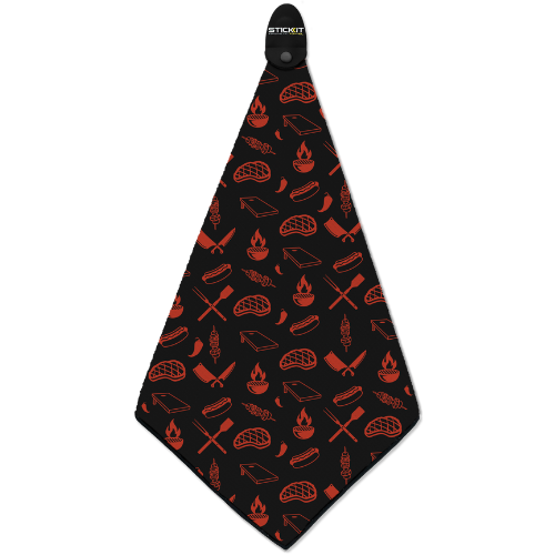 Black barbecue apron with red grilling-themed patterns, including tools and food items, perfect for outdoor cooking.