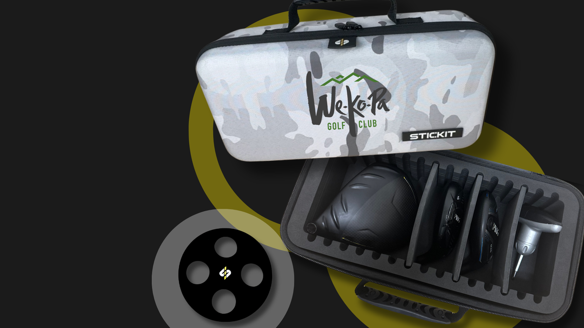 Gray camouflage golf club travel case with sturdy handles, featuring a secure inner compartment for protecting clubs.