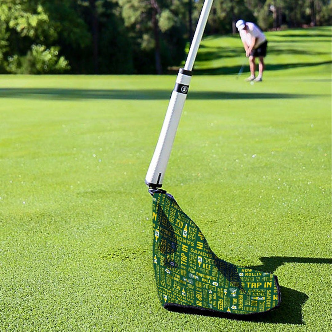Green golf wedge with a fun graphic pattern, featuring phrases and icons, perfect for improving your short game.