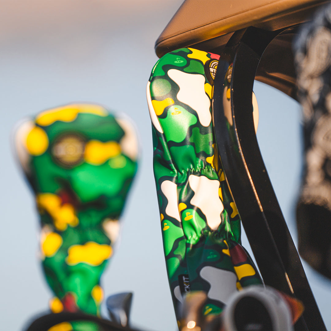 Green and yellow camo golf club headcovers, stylish and durable, designed for a modern golfing aesthetic.