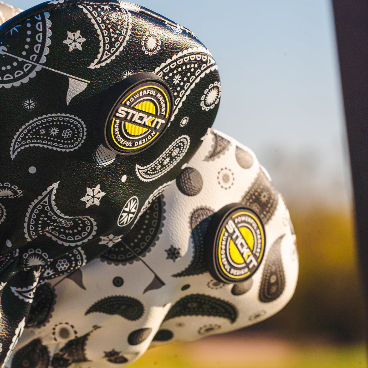 Black and white paisley patterned Stickit seat cover with durable material, stylish design for bicycles.