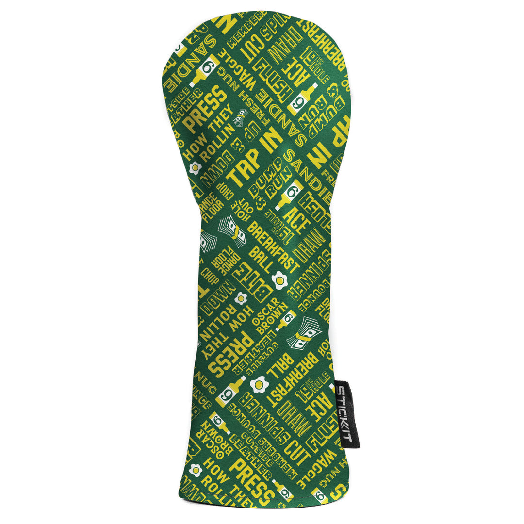 Green and yellow patterned golf club headcover, featuring motivational phrases, made from durable fabric.