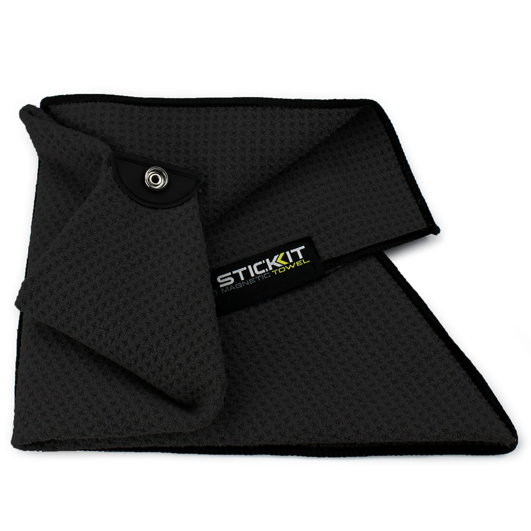 Gray microfiber towel with textured surface and snap button, ideal for gym and sports use.