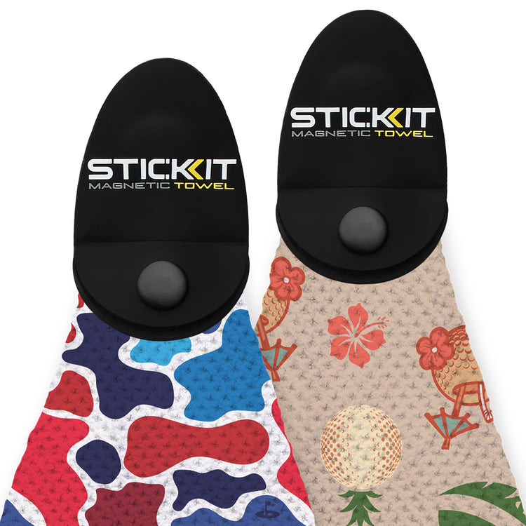 Colorful STICKit magnetic towels featuring a blue camouflage pattern and a floral design, both with black holders.