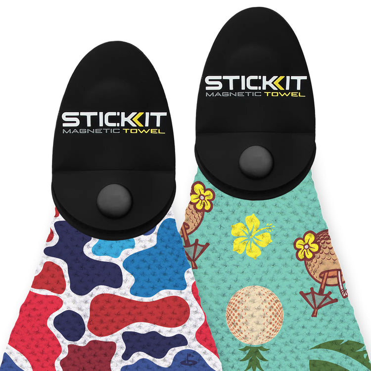 Two vibrant STICKIT magnetic towels featuring a red and blue camouflage design and a tropical print, both with black grips.