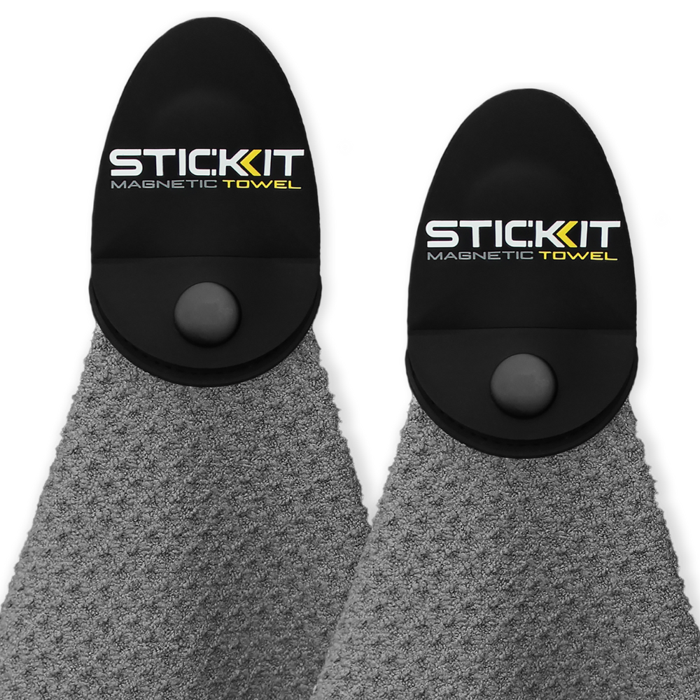 Gray microfiber magnetic towel with black holder, ideal for gym and outdoor use, featuring STICKIT branding.