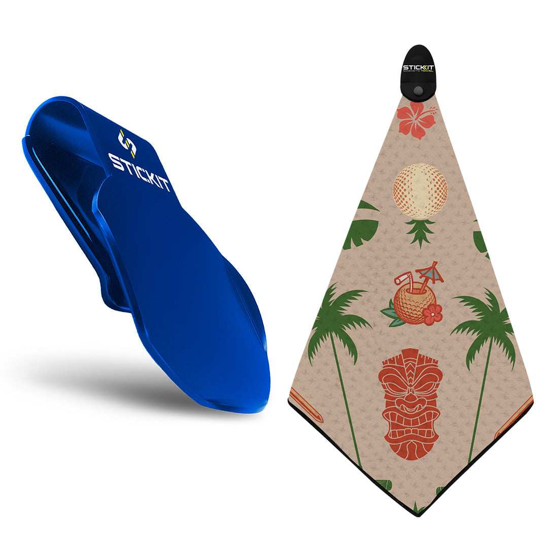 Blue silicone holder with a Hawaiian-themed golf towel featuring palm trees and tiki designs in tan and orange.
