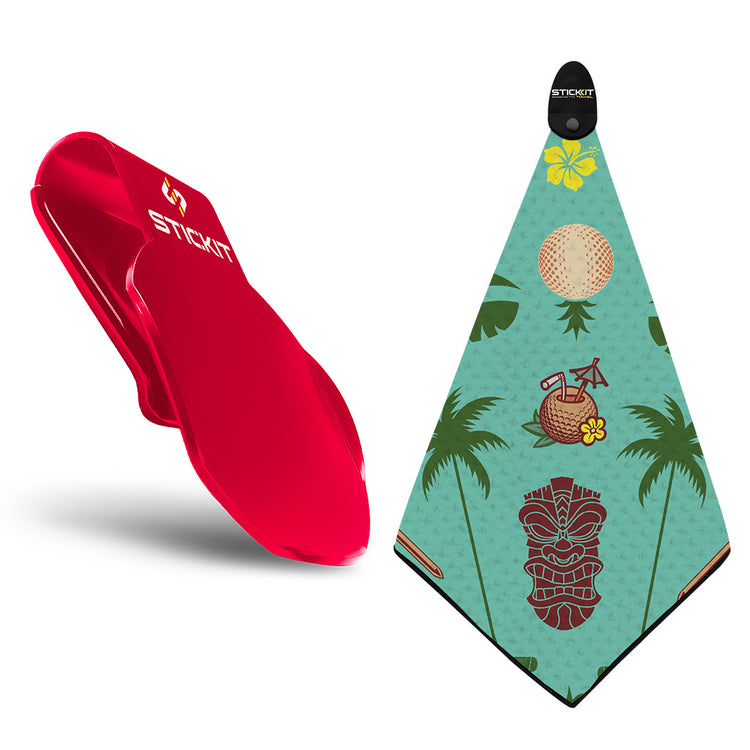 Red StickIt paddle and tiki-themed towel featuring green, brown, and yellow designs perfect for beach outings.