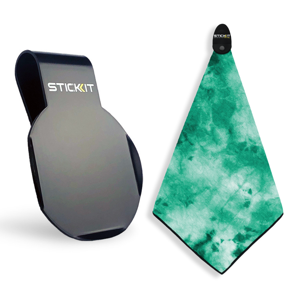 Black STICKIT clip with a green tie-dye microfiber towel, perfect for active lifestyles and outdoor adventures.