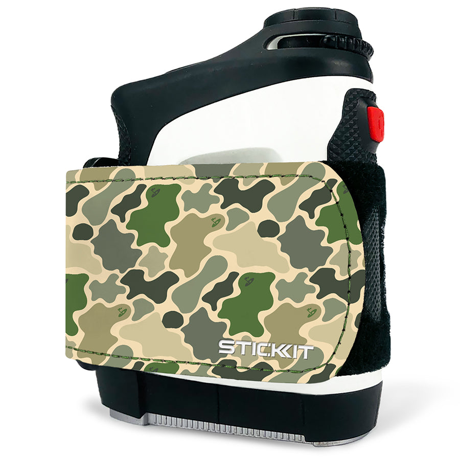 Green camo Stick Kit holder with black strap, designed for holding technology accessories, featuring durable materials.