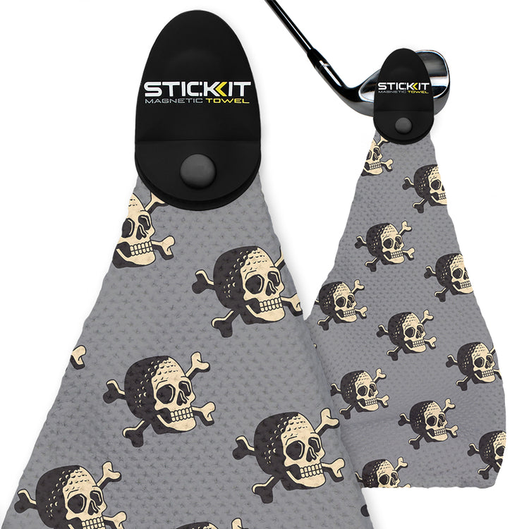 Gray skull-patterned magnetic golf towel with black clips, featuring a unique pirate theme for stylish functionality.