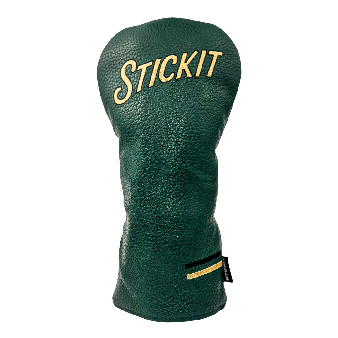 Green leather golf headcover with "STICKIT" embroidered in gold and black stripes on the side for a stylish finish.