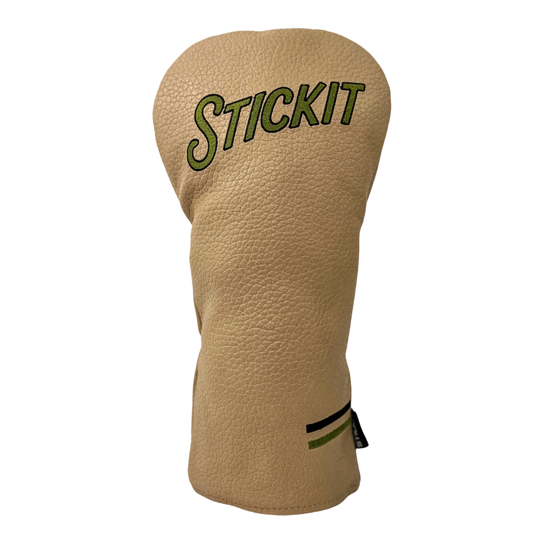 Beige leather golf headcover with "STICKIT" embroidered in green and black detailing, featuring a classic design.