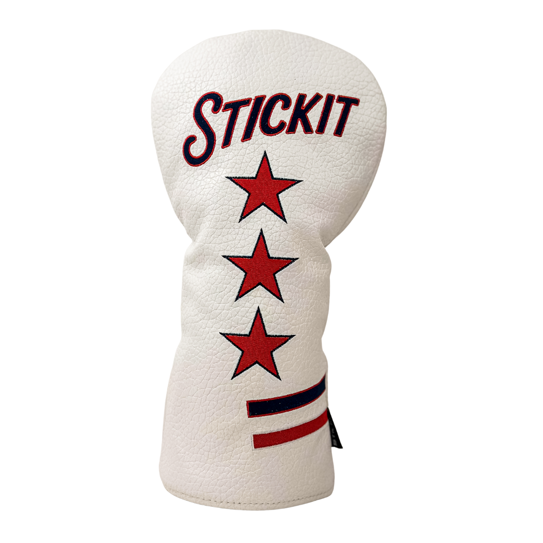 White leather golf headcover with red stars and "STICKIT" in bold lettering, featuring a stylish striped accent.
