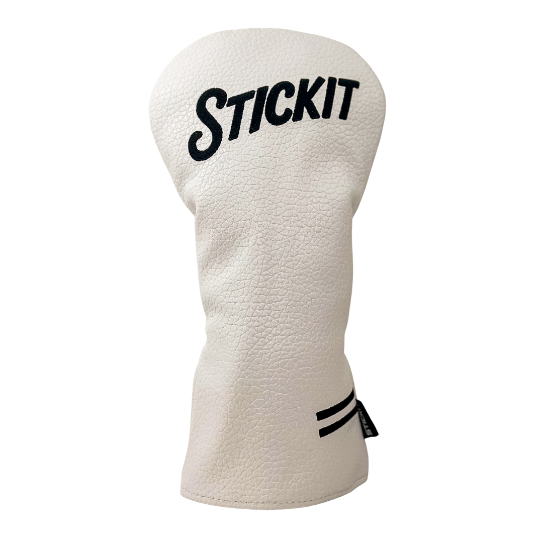 White leather golf club headcover with black "STICKIT" logo and striped accents for stylish protection.