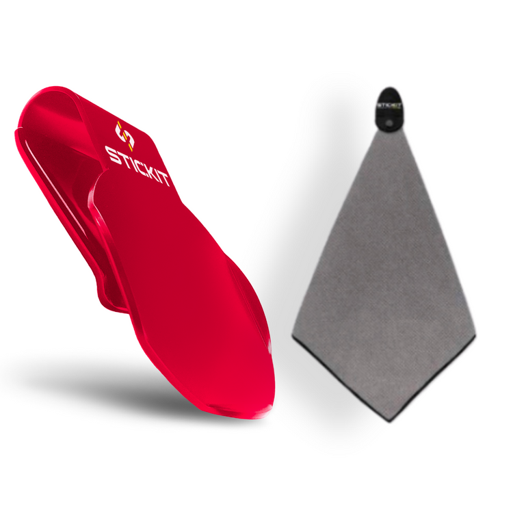 Red silicone phone wallet with StickIt logo and gray microfiber cleaning cloth, perfect for tech enthusiasts.