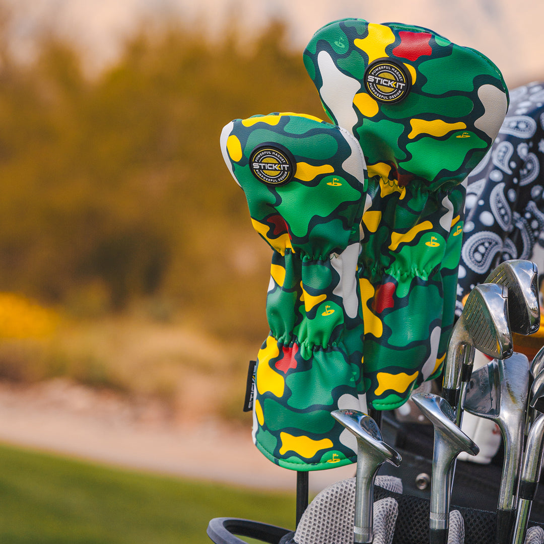Green camo golf club headcovers with yellow accents, made from durable polyester, showcasing a stylish and functional design.