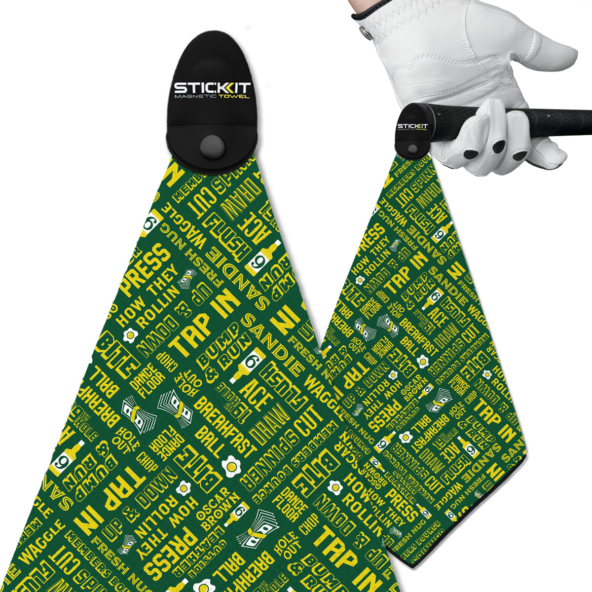 Green golf towel featuring bold, white text with various golf terms, made of soft microfiber for easy absorption.
