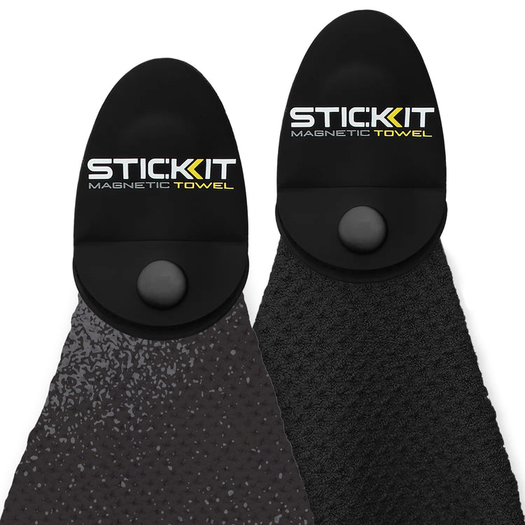 Two Stic Kit magnetic towels in black and dark grey, featuring textured material and unique snap-on design.