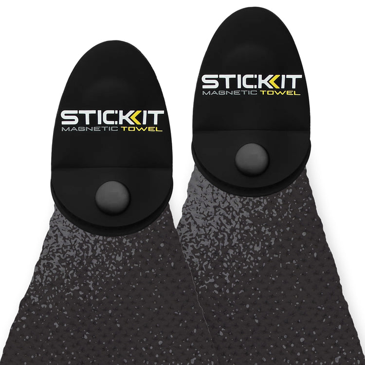 Black magnetic towel with textured surface, featuring STIC:KIT logo for active lifestyle use.