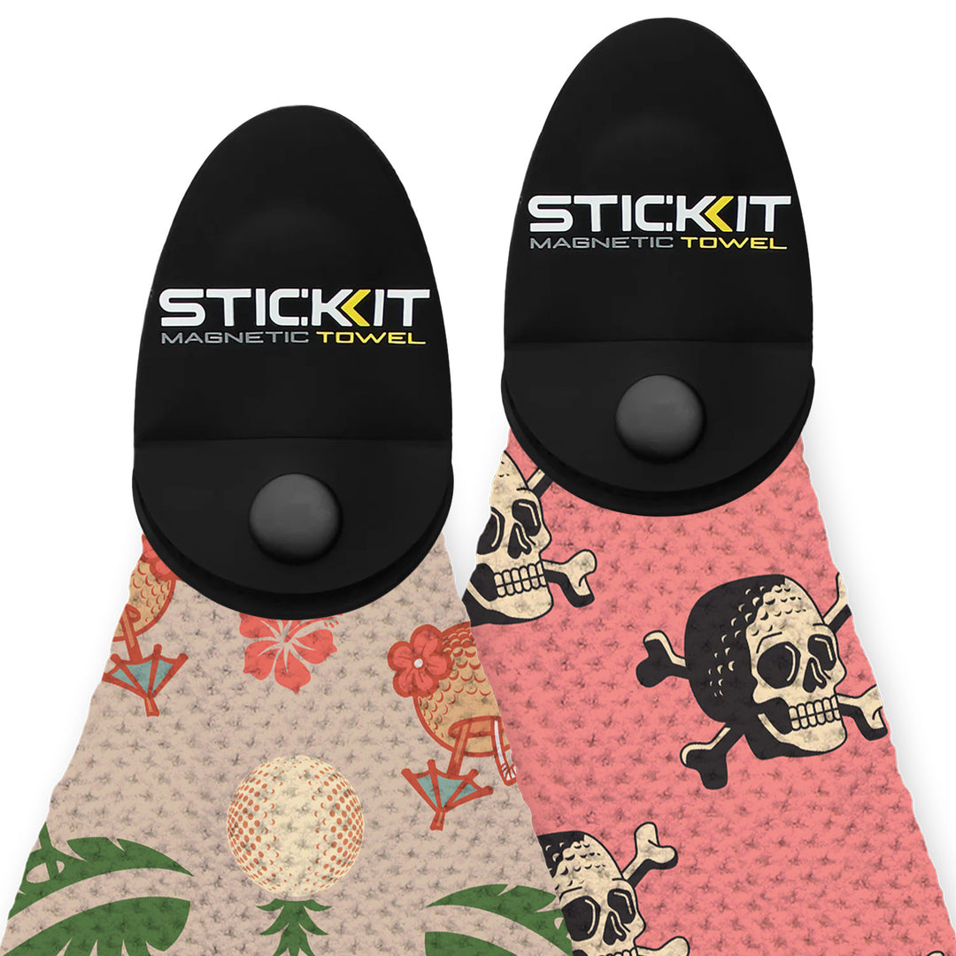 Black magnetic towel with two-sided designs: vibrant floral and pirate skull patterns. Ideal for beach and outdoor use.