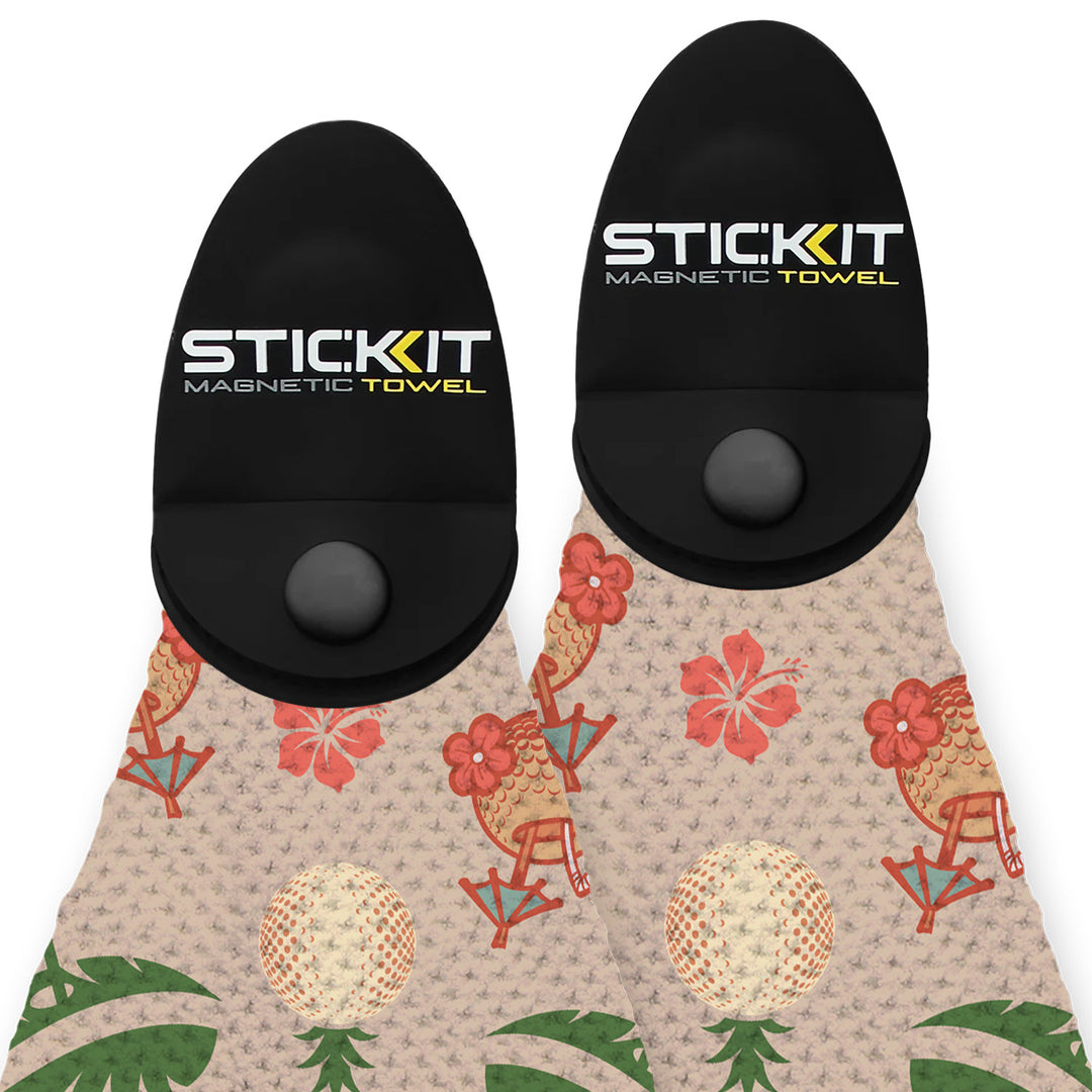 "SticKit magnetic towel with black holder and tropical floral pattern in vibrant colors, perfect for beach or gym use."