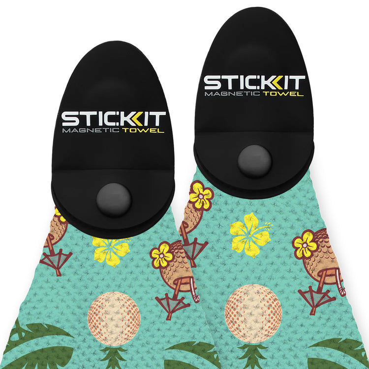 Colorful tropical-patterned magnetic towel in teal and black, featuring hibiscus and palm motifs for beach use.