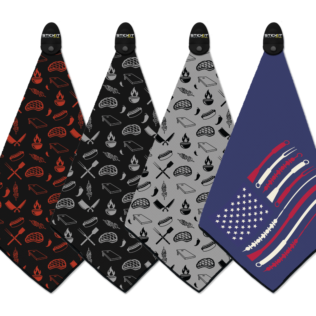 Set of four cotton BBQ grill towels: red, black, gray, and navy with food-themed and patriotic designs.