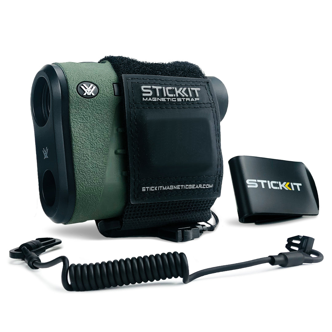 Green magnetic strap for rangefinder, with a durable design and elastic cord for secure attachment. Ideal for outdoor use.